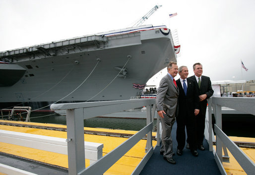 President George W. Bush, father President George H. W. Bush and brother Florida Governor Jeb Bush depart at the conclusion of the Christening Ceremony for the George H.W. Bush (CVN 77) in Newport News, Virginia, Saturday, Oct. 7, 2006. White House photo by Eric Draper