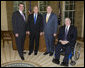 President George W. Bush welcomes Bob Wallace, left, the executive director of the Veterans of Foreign Wars Washington Office; Gary Kurpius, the National Commander-In-Chief of the Veterans of Foreign Wars and Gordon Mansfield, right, the deputy secretary at the Department of Veterans Affairs, to the Oval Office for a meeting Wednesday, Oct. 11, 2006. The VFW, founded in 1899, is the largest organization of combat veterans with some 2.4 million members in 9,500 VFW Posts worldwide. White House photo by Paul Morse