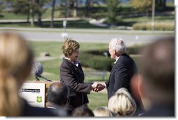 Mrs. Laura Bush shakes hands with Andy Taylor, chairman and CEO of Enterprise Rent-A-Car, following her remarks Thursday, October 11, 2006, during a tree planting ceremony for the Enterprise 50 Million Tree Pledge in St. Louis, Missouri. White House photo by Shealah Craighead