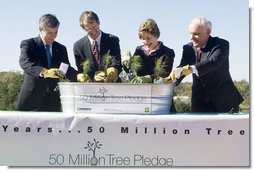 Mrs. Laura Bush is joined by, from left, U.S. Department of Agriculture Secretary Mike Johanns; John Rosenow, president of the National Arbor Day Foundation, and Andy Taylor, chairman and CEO of Enterprise Rent-A-Car, as they plant White Pine saplings Thursday, October 11, 2006, during a ceremony for the Enterprise 50 Million Tree Pledge in St. Louis, Missouri. Enterprise Rent-A-Car donated $50 million to the National Arbor Day Foundation to plant 50 million trees in National Forests over the next 50 years. The White Pine saplings planted at the ceremony will be re-planted permanently in the Mark Twain National Forest in southern Missouri.  White House photo by Shealah Craighead