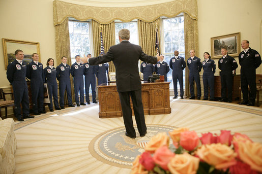 President George W. Bush gestures as he speaks to the U.S. Air Force Thunderbirds during their visit to the Oval Office, Friday, Oct. 13, 2006. The Thunderbirds are scheduled to perform a fly over for the opening of the Air Force Memorial in Arlington, Va., Saturday, Oct. 14, 2006. White House photo by Eric Draper