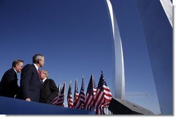 President George W. Bush observes the Air Force Thunderbirds performing at the dedication of the United States Air Force Memorial in Arlington, Virginia on October 14, 2006. White House photo by Paul Morse