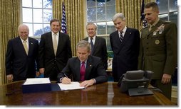 President George W. Bush signs into law H.R. 5122, the John Warner National Defense Authorization Act for Fiscal Year 2007, Tuesday, Oct. 17, 2006, in the Oval Office. Joining him are from left: Vice President Dick Cheney, Rep. Duncan Hunter of California, Secretary of Defense Donald Rumsfeld, Sen. John Warner of Virginia, and General Peter Pace, Chairman, Joint Chiefs of Staff.  White House photo by Eric Draper