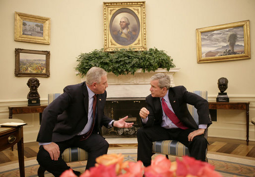 President George W. Bush and the Prime Minister of the Republic of Croatia H.E. Ivo Sanader talk together in the Oval Office at the White House, Tuesday, Oct. 17, 2006. White House photo by Eric Draper