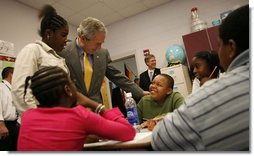 President George W. Bush spends time with students at the Waldo C. Falkener Elementary School Wednesday, Oct. 18, 2006, in Greensboro, N.C. The President visited with third- and fifth-graders before delivering his remarks on the No Child Left Behind Act. White House photo by Paul Morse