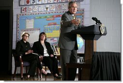 President George W. Bush delivers remarks Wednesday, Oct. 18, 2006, on No Child Left Behind during a visit to the Waldo C. Falkener Elementary School in Greensboro, N.C. The President congratulated the school's principal, teachers and the parents for "working hard to make this a fantastically interesting place for our children to go to school." Seated in the background are Secretary of Education Margaret Spellings and Dr. Amy Holcombe, Principal of the school.  White House photo by Paul Morse