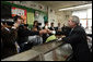 President George W. Bush is handed an ice cream cone during a visit to Manning's Ice Cream and Milk in Clarks Summit, Pa., Thursday, Oct. 19, 2006. White House photo by Paul Morse