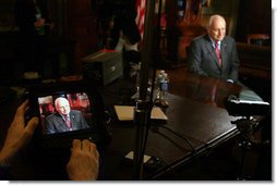 Vice President Dick Cheney is seen on a TV monitor during a radio and television interview with Sean Hannity of FOX News in the Vice President's Ceremonial Office, Tuesday, October 24, 2006.  White House photo by David Bohrer