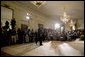 President George W. Bush walks into the East Room for a press conference in Wednesday, Oct. 25, 2006. "Our security at home depends on ensuring that Iraq is an ally in the war on terror and does not become a terrorist haven like Afghanistan under the Taliban," said President Bush. White House photo by Paul Morse