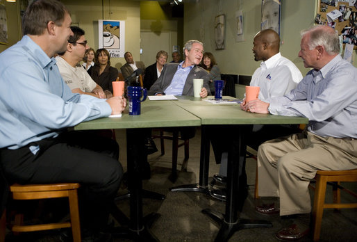 President George W. Bush talks with small business owners before delivering a live Radio Address from the Mile High Coffee shop in Englewood, Colorado, Saturday, Nov. 4, 2006. White House photo by Eric Draper