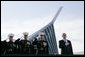 President George W. Bush joins, from left, U.S. Marine Corps Lt. Gen. James Amos; Chairman of the Joint Chiefs of Staff General Peter Pace and Commandant of the Marine Corps, General Michael Hagee, during the National Anthem at the dedication ceremony of the National Museum of the Marine Corps Friday, Nov. 10, 2006, in Quantico, Va. White House photo by Paul Morse