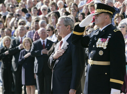 President George W. Bush is joined by Major General Guy Swan III, Commander of the Joint Force Headquarters National Capital Region & U.S. Army Military District of Washington, during the Veteran’s Day ceremonies Saturday, Nov. 11, 2006, at Arlington National Cemetery in Arlington, Va. White House photo by Kimberlee Hewitt