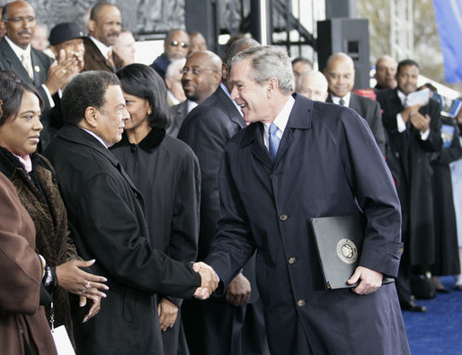 President George W. Bush greets former United Nations Ambassador Andrew Young Monday, Nov. 13, 2006, following President Bush’s speech at the groundbreaking ceremony for the Martin Luther King Jr. National Memorial on the National Mall in Washington, D.C. White House photo by Eric Draper