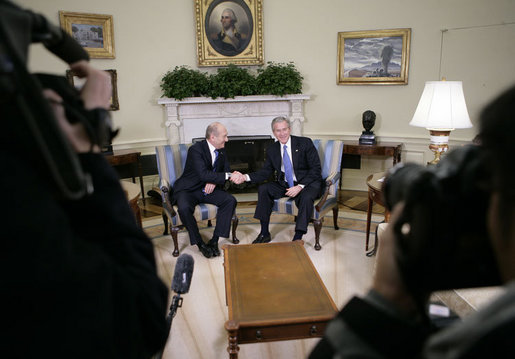 President George W. Bush and Israeli Prime Minister Ehud Olmert shake hands during a brief question and answer opportunity with members of the media Monday, Nov. 13, 2006, in the Oval Office at the White House. White House photo by Eric Draper