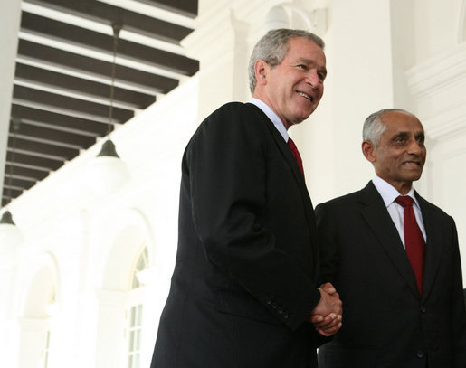 President George W. Bush is welcomed to Istana, the presidential palace, by Singapore's Acting President J.Y. Pillay, Thursday, Nov. 16, 2006. White House photo by Paul Morse