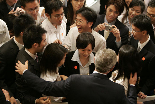 President George W. Bush greets students after delivering remarks Thursday, Nov. 16, 2006, at the National University of Singapore. White House photo by Paul Morse