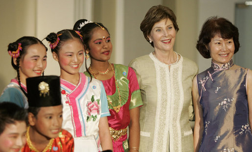 Mrs. Laura Bush stands with Jenny Law, principal of the Bukit View Primary School in Singapore, as they pose with student members of the Bukit View Primary School dance troupe Thursday, Nov. 16, 2006. The kids performed for President George W. Bush and Mrs. Bush during a visit Thursday morning to the Asian Civilisations Museum. White House photo by Paul Morse