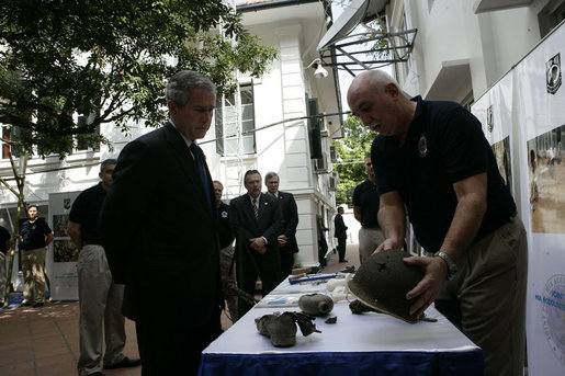 Forensic archaeologist Dr. Bradley Sturm briefs President George W. Bush during a visit Saturday, Nov. 18, 2006, to the POW/MIA Accounting Command in Hanoi. White House photo by Eric Draper