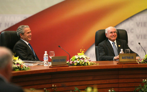 President George W. Bush shares a light moment with Prime Minister John Howard of Australia as they participate in the first retreat of the APEC leaders Saturday, Nov. 18, 2006, at the National Conference Center in Hanoi. White House photo by Eric Draper