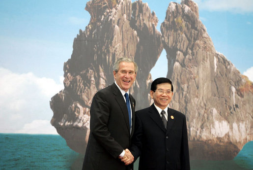 President George W. Bush and President Nguyen Minh Triet of Vietnam share in a photo opportunity Saturday, Nov. 18, 2006, at the National Conference Center in Hanoi prior to the start of the first retreat of the 2006 APEC Summit. White House photo by Paul Morse
