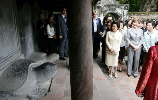 Mrs. Laura Bush is joined by other spouses of APEC leaders Saturday, Nov. 18, 2006, as they tour the Temple of Literature in Hanoi, site of the 2006 APEC summit. White House photo by Shealah Craighead