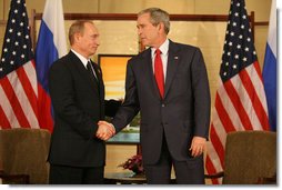 President George W. Bush and President Vladimir Putin of Russia exchange handshakes Sunday, Nov. 19, 2006, at the Sheraton Hanoi after their two countries signed agreements supporting Russia's accession into the World Trade Organization. Said President Bush afterward, "This is a good agreement for the United States. And it's an equally important agreement for Russia. And it's a good agreement for the international trading community." White House photo by Eric Draper