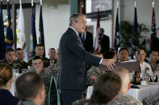 President George W. Bush delivers his remarks following his breakfast meeting with U.S. military troops at Hickam Air Force Base, Tuesday, Nov. 21, 2006 in Honolulu, Hawaii. President Bush thanked the group for their warm reception and for their service and sacrifice to the nation. White House photo by Paul Morse