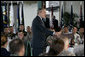 President George W. Bush delivers his remarks following his breakfast meeting with U.S. military troops at Hickam Air Force Base, Tuesday, Nov. 21, 2006 in Honolulu, Hawaii. President Bush thanked the group for their warm reception and for their service and sacrifice to the nation. White House photo by Paul Morse
