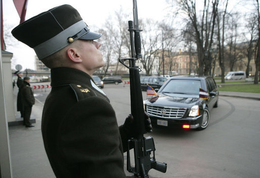 An honor guard stands at attention as the limousine carrying President George W. Bush arrives Tuesday, Nov. 28, 2006, at Riga Castle in Riga, Latvia, where the President met with Latvian President Vaira Vike-Freiberga. White House photo by Eric Draper