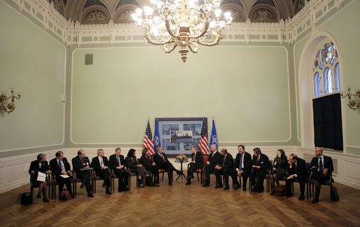 President George W. Bush, center left, meets with NATO Secretary General Jaap de Hoop Scheffer, center right, inside Latvia University Tuesday, Nov. 28, 2006, in Riga. White House photo by Eric Draper