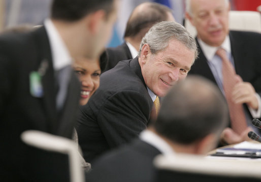 President George W. Bush and Secretary of State Condoleezza Rice share a light moment with NATO heads of state and officials Wednesday, Nov. 29, 2006, during the 2006 NATO Summit in Riga, Latvia. White House photo by Paul Morse