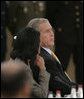 President George W. Bush confers with Secretary of State Condoleezza Rice Wednesday, Nov. 29, 2006, during the 2006 NATO Summit in Riga, Latvia. White House photo by Paul Morse