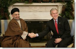 President George W. Bush welcomes Sayyed Abdul-Aziz Al-Hakim, Leader of the Supreme Council for the Islamic Revolution in Iraq, to the White House Monday, Dec. 4, 2006. Said the President, "I appreciate so very much His Eminence's commitment to a unity government. I assured him the United States supports his work and the work of the Prime Minister to unify the country." White House photo by Eric Draper