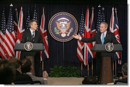 President George W. Bush responds to a question during a joint news conference with British Prime Minister Tony Blair, Thursday, Dec. 7, 2006, in the Dwight D. Eisenhower Executive Office Building. 