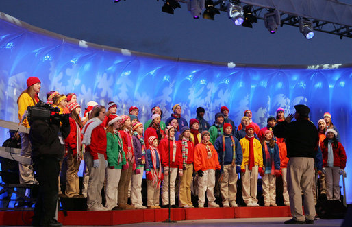 Members of The Singing Angels choir, under the direction of Charles Eversole, perform Thursday evening, Dec. 7, 2006, during the 2006 Christmas Pageant of Peace and lighting of the National Christmas Tree on the Ellipse in Washington, D.C. White House photo by Kimberlee Hewitt