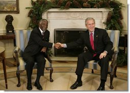 President George W. Bush welcomes Thabo Mbeki, President of South Africa, to the Oval Office Friday, Dec. 8, 2006. The leaders talked about a wide range of subjects, according to the President, ".including Darfur and the need for South Africa and the United States and other nations to work with the Sudanese government to enable a peacekeeping force into that country to facilitate aid and save lives."  White House photo by Paul Morse