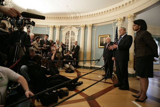 President George W. Bush stands with Secretary of State Condoleezza Rice and Vice President Dick Cheney as he speaks to the media following a meeting Monday, Dec. 11, 2006, with senior U.S. Department of State officials on Iraq at the State Department in Washington, D.C. White House photo by Eric Draper