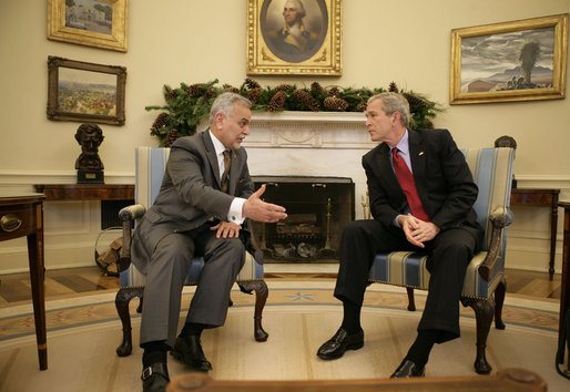 President George W. Bush meets with Vice President Tariq al-Hashemi of Iraq in the Oval Office Tuesday, Dec. 12, 2006. The two men spent their time together talking about the conditions in Iraq and what the United States can do to help the country's government succeed. White House photo by Eric Draper