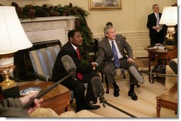 President George W. Bush welcomes President Boni Yayi of Benin to the White House Thursday, Dec. 14, 2006. Among other issues, the two leaders talked about joint efforts to combat HIV/AIDS and malaria in Benin. White House photo by Eric Draper