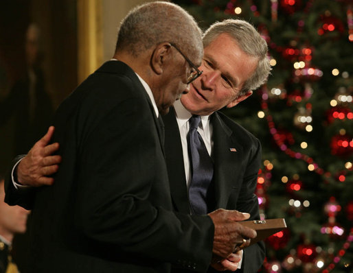 President George W. Bush presents the 2006 Presidential Medal of Freedom to Warren O'Neil on behalf of his brother, baseball great Buck O'Neil, who passed away at the age of 94 in October. Said the President upon presentation of the honor, "Buck O'Neil lived long enough to see the game of baseball, and America, change for the better. He's one of the people we can thank for that. Buck O'Neil was a legend, and he was a beautiful human being. And we honor the memory of Buck O'Neil." White House photo by Shealah Craighead