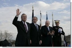 Secretary of Defense Donald Rumsfeld acknowledges a standing ovation in his honor joined by President George W. Bush, Vice President Dick Cheney and General Peter Pace, Chairman of the Joint Chiefs of Statf, following Rumsfeld's farewell address Friday, Dec. 15, 2006, at the Armed Forces Full Honor Review at the Pentagon. The Secretary, who has served since 2001, told the audience that he will remember "all those couragous folks that I have met deployed in the field; those in the military hospitals that we visited; and I will remember the fallen, and I will particularly remember their families from whom I have drawn inspiration."  White House photo by Eric Draper
