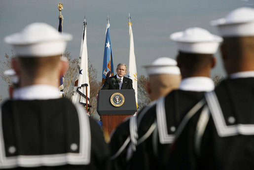 President George W. Bush addresses the troops during an Armed Forces Full Honor Review at the Pentagon Friday, Dec. 15, 2006, in honor of outgoing Secretary of Defense Donald Rumsfeld, who served since 2001, telling the audience that Secretary Rumsfeld is "one of America's most skilled, energetic and dedicated public servants." White House photo by Paul Morse