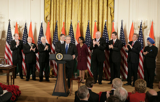 President George W. Bush is applauded as he addresses his remarks to invited guests prior to signing H.R. 5682 The United States-India Peaceful Atomic Cooperation Act, Monday, Dec. 18, 2006, in the East Room of the White House. Left to right are Rep. Thaddeus McCotter, R-Mich.; Rep.Gary Ackerman, D- NY; Sen. Richard Lugar, R-Ind.; Sen. Bill Frist, R-Tenn.; Secretary of State Condoleezza Rice; Rep. Joseph Crowley, D-NY; Sen. George Allen, R- Va.; Rep. Frank Pallone Jr., D-NJ; and Ambassador to the U.S. Raminder Jassal, Charge D’affaires of India. White House photo by Eric Draper