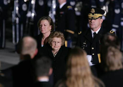 Former first lady Betty Ford and her daughter, Susan Ford Bales are escorted by Major General Guy Swan III upon the arrival of the casket of former President Gerald R. Ford to Andrews Air Force Base, Md., Saturday evening, Dec. 30, 2006, for the State Funeral ceremonies at the U.S. Capitol. White House photo by Shealah Craighead