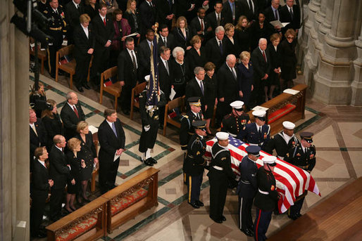 The casket of former President Gerald R. Ford is carried by military pallbearers to the front of the National Cathedral during his State Funeral in Washington, D.C., January 2, 2007. White House photo by Paul Morse