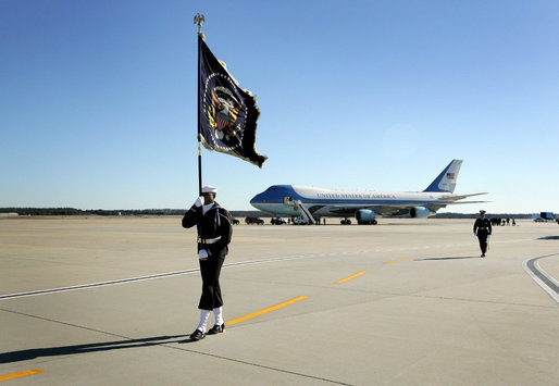 A Naval honor guard carries the Presidential Colors on the tarmac of Andrews Air Force Base, Md., as the plane carrying the body of former President Gerald R. Ford prepares to depart for Grand Rapids, Mich., Tuesday, January 2, 2007, following the former president's State Funeral in Washington, D.C. White House photo by David Bohrer