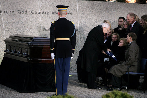 Vice President Dick Cheney presents the flag that draped the casket of former President Gerald R. Ford to former first lady Betty Ford during interment ceremonies at the Gerald R. Ford Presidential Museum in Grand Rapids, Mich., Wednesday, January 3, 2007. White House photo by David Bohrer
