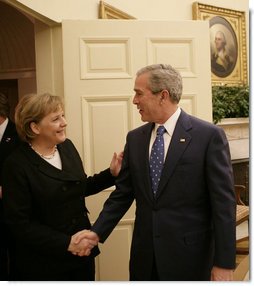 President George W. Bush welcomes German Chancellor Angela Merkel to the Oval Office, Thursday, Jan. 4, 2006, at the White House.  White House photo by Eric Draper