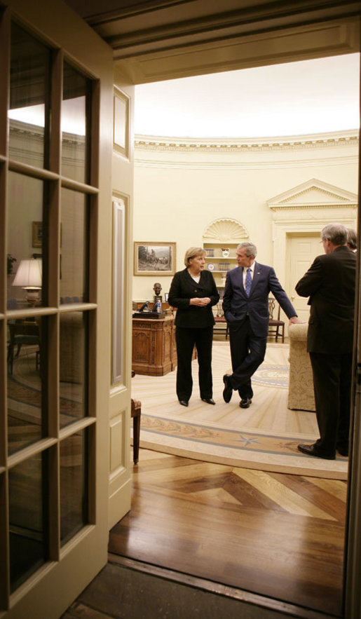 President George W. Bush and German Chancellor Angela Merkel meet in the Oval Office, Thursday, Jan. 4, 2006, prior to their joint news conference at the White House. White House photo by Eric Draper