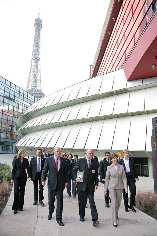 The Eiffel Tower stands tall in the background as Mrs. Laura Bush walks with Stephane Martin, President of the Musee du quai Branly, center, in Paris Monday, Jan. 15, 2007. Mrs. Bush toured the museum with US Ambassador Craig Stapleton, left, and his wife Mrs. Stapleton. White House photo by Shealah Craighead